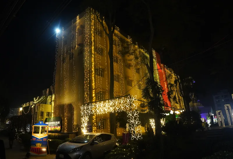 Decorative facade lighting installed across a building at night