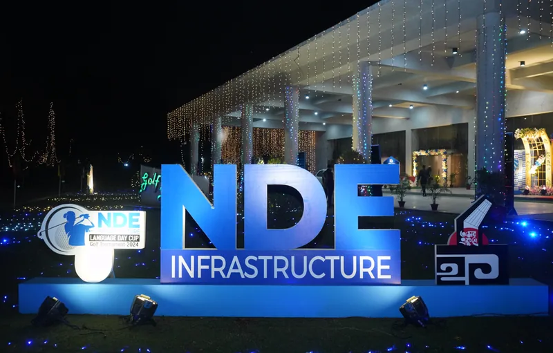 Illuminated NDE Infrastructure LED channel-letter signage at night