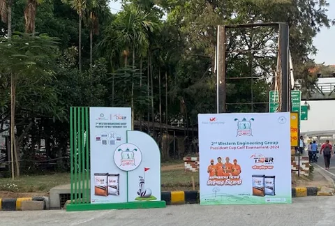 Free-standing printed cut-out standees installed along a park walkway